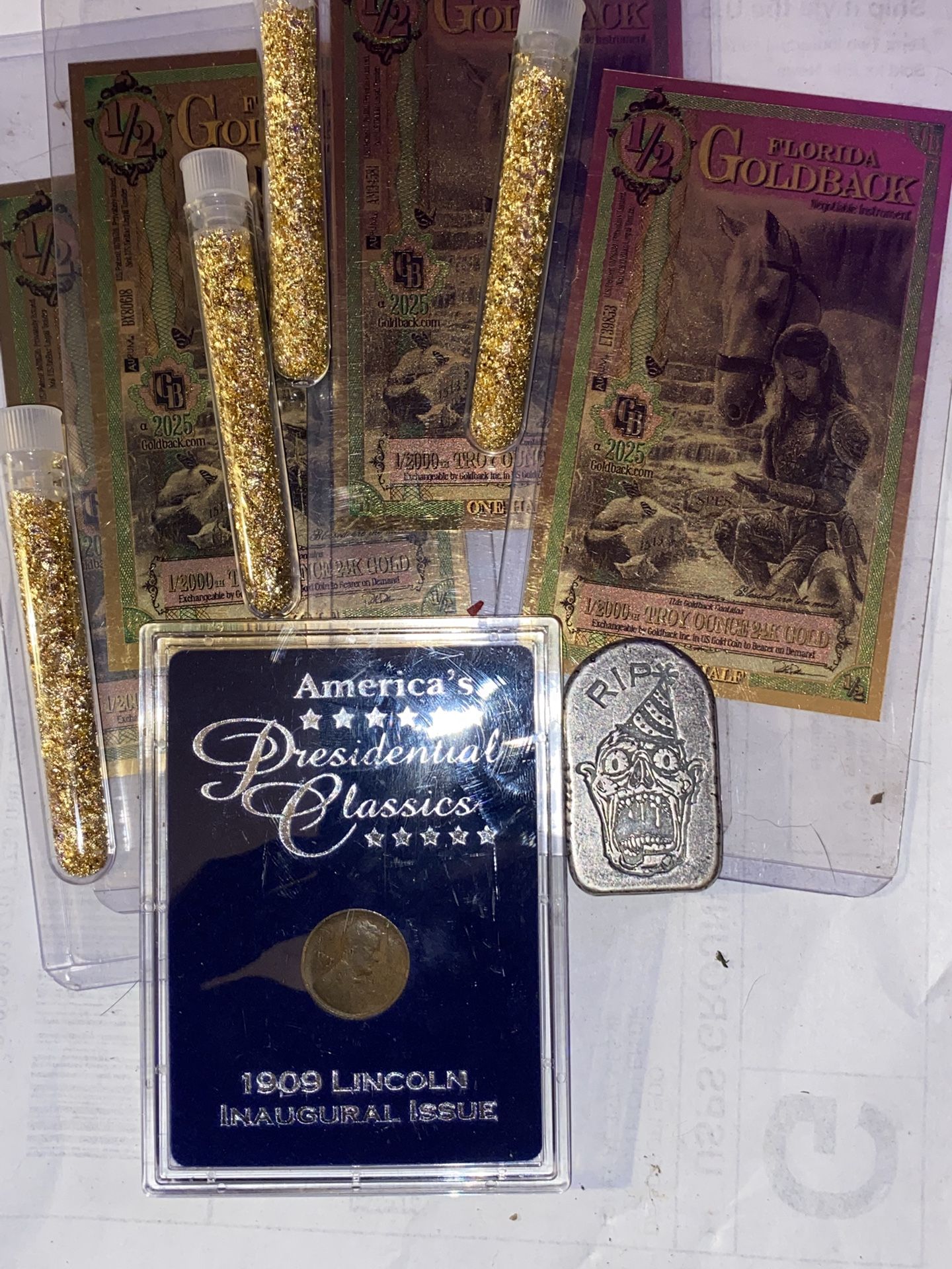 Real gold quarterbacks half one, 220 ounce gold 12 ounce rest in peace one 1909 Lincoln
