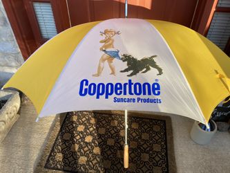 Large Coppertone umbrella with wood handle and sheath