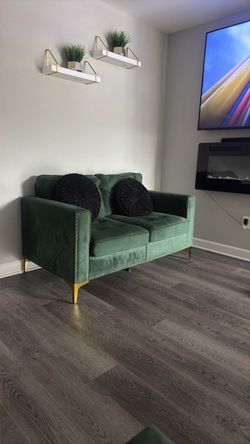 Green love seat and sofa