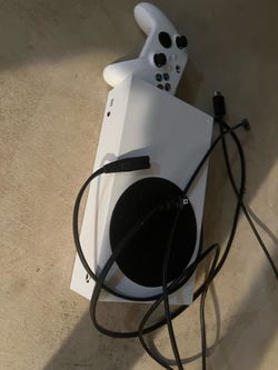 Xbox series s with cords and controllers