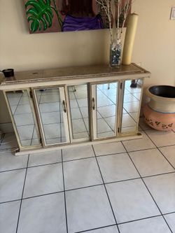 Vintage marble top and mirrored entry way condole …55” wide , 16” depth, 30” high $80 Will not last