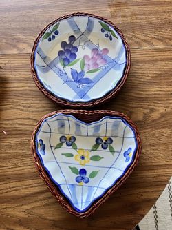 Hand-Painted Ceramic Dishes in Wicker Baskets