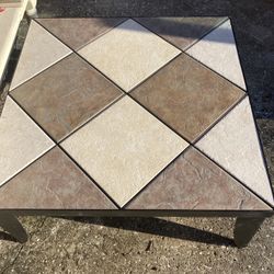 Unique coffee table with metal frame and legs and removable tiles to create your own design