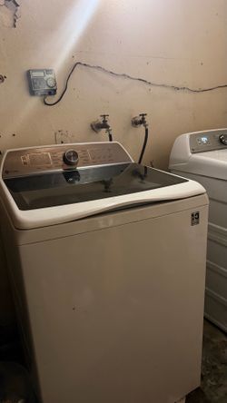 Whirlpool Refrigerator, GE washer and dryer.