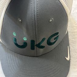 Nike UKG golf hat with a mesh trucker design and embroidered branding.  Nike grey and green UKG hat #golf #golfwear