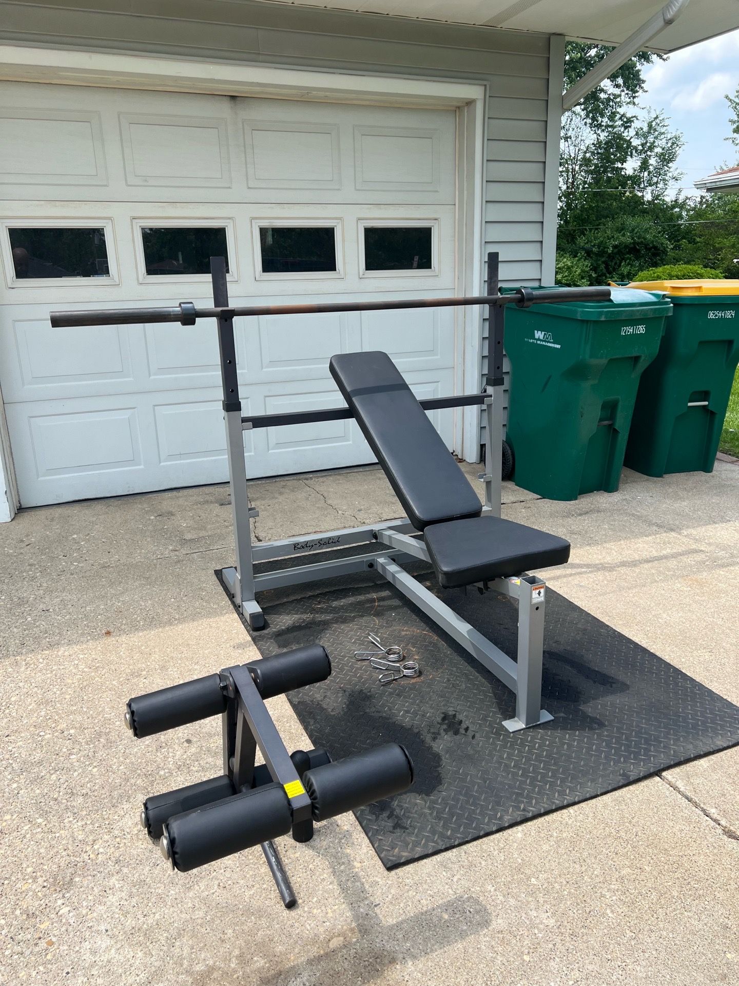 Body Solid olympic weight bench with Olympic barbell and heavy duty Matt