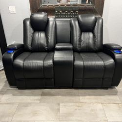 Black Leather Power Reclining Love Seat With console 