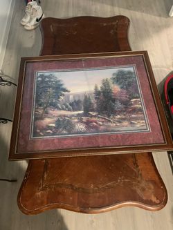 Table and broken picture frame