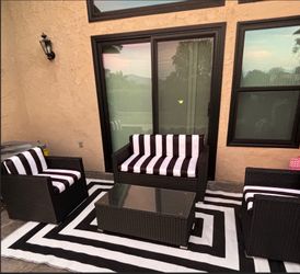 4 piece patio furniture set with matching covers and rug