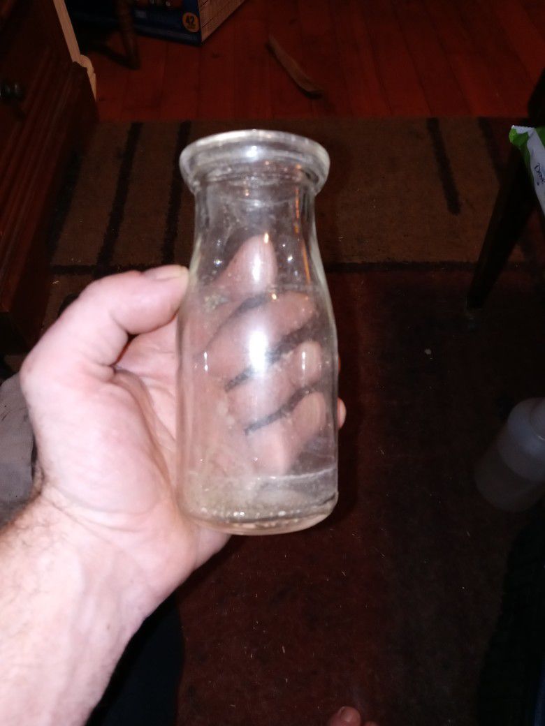 Small vintage glass milk bottle