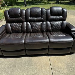 Like new living room set! Adjustable electric reclining sofa, loveseat, recliner. W/ Coffee table.