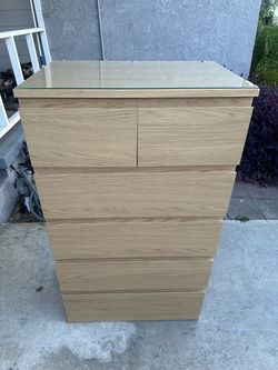 Brown oak tall dresser with glass on top
