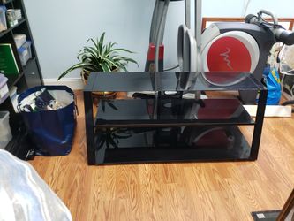 Tv stand 48 inches wide, depth 12 inches top.