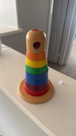 Montessori-style wooden stacking tower.