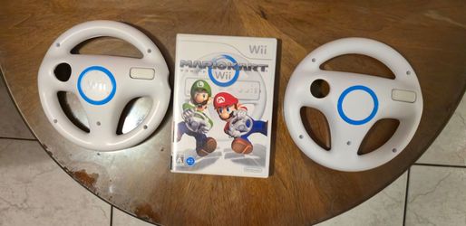 Nintendo Mario Kart Wii with 2 Wii Mario racing Wheels.