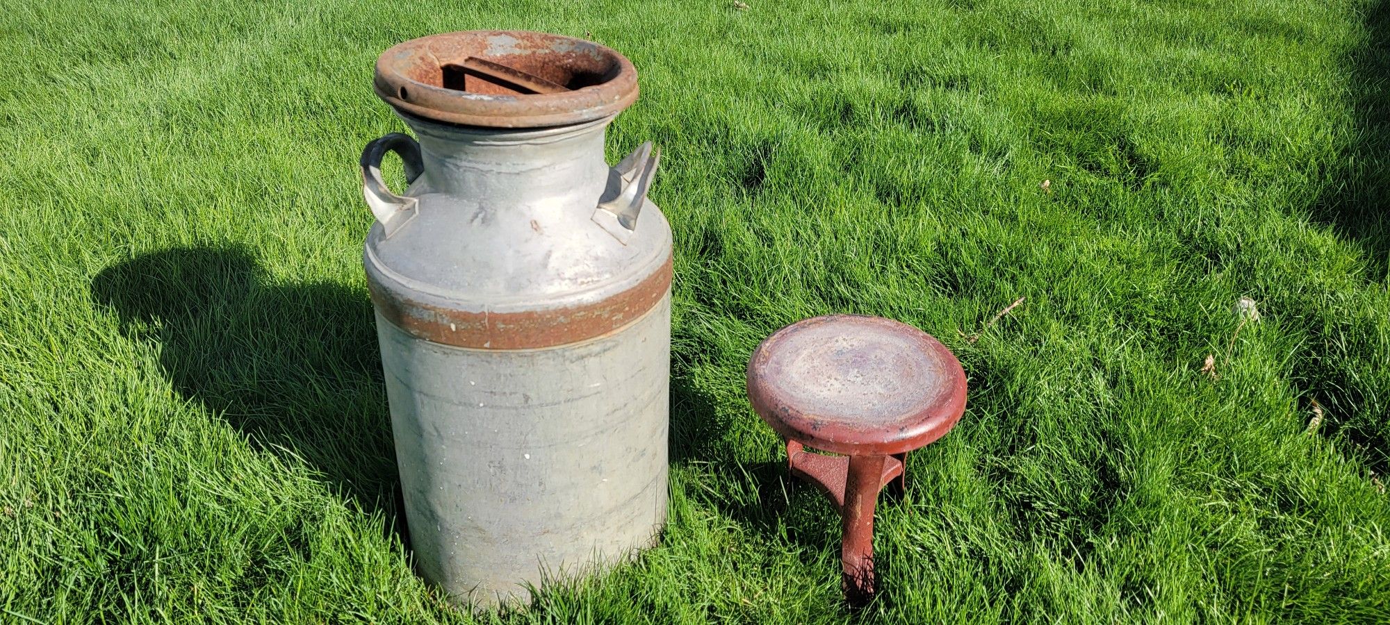 Antique Farm Milking Collectables 3 legged Steel stool $65. (RARE) Vintage Milk Can $50.