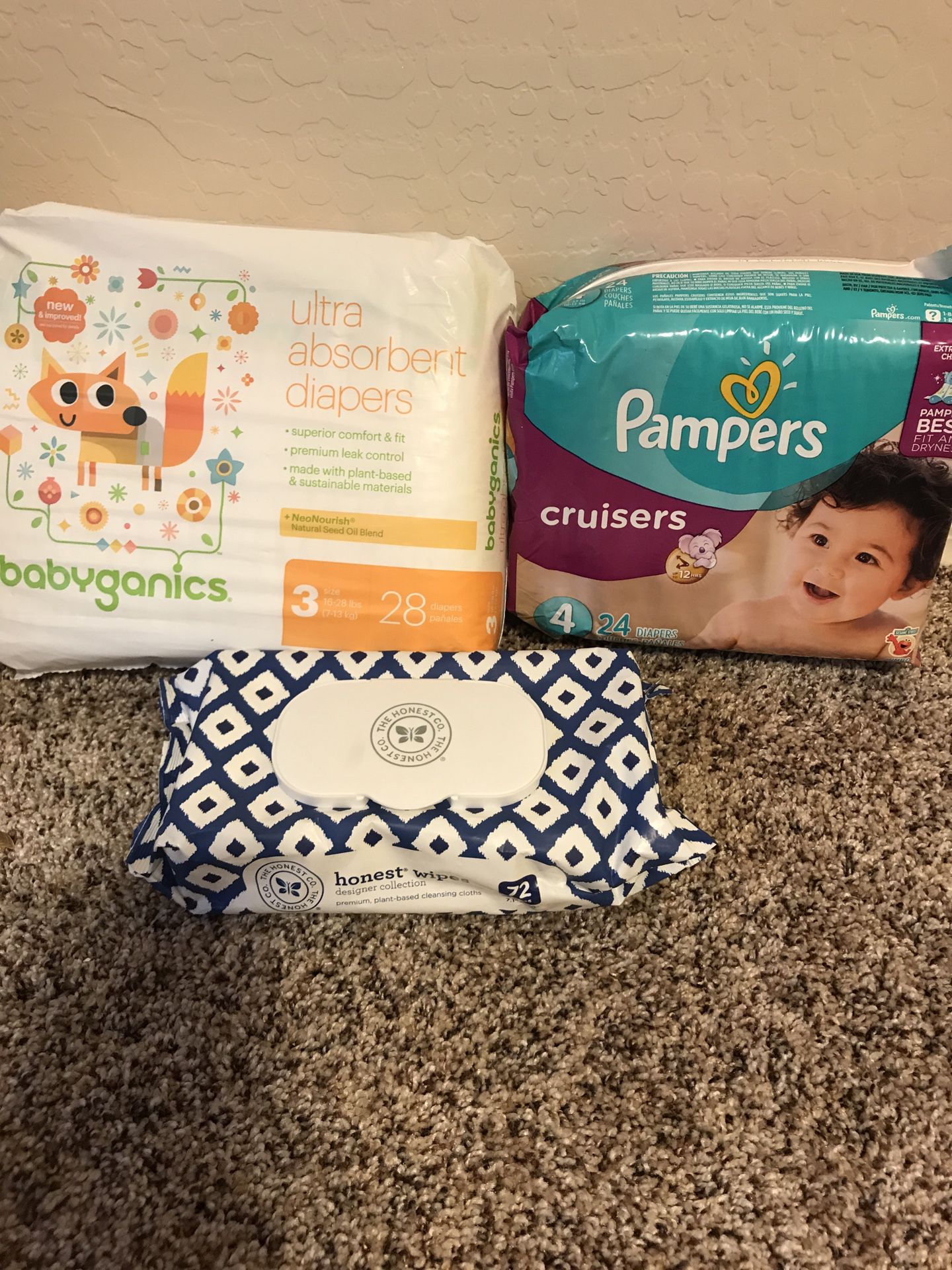 Baby diapers, wipes, and clothes hanger