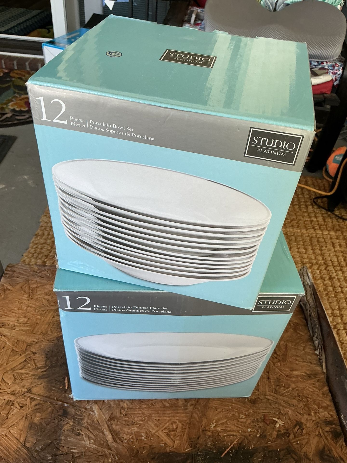 Studio Platinum 12-piece porcelain bowl set and a 12-piece porcelain dinner plate set.