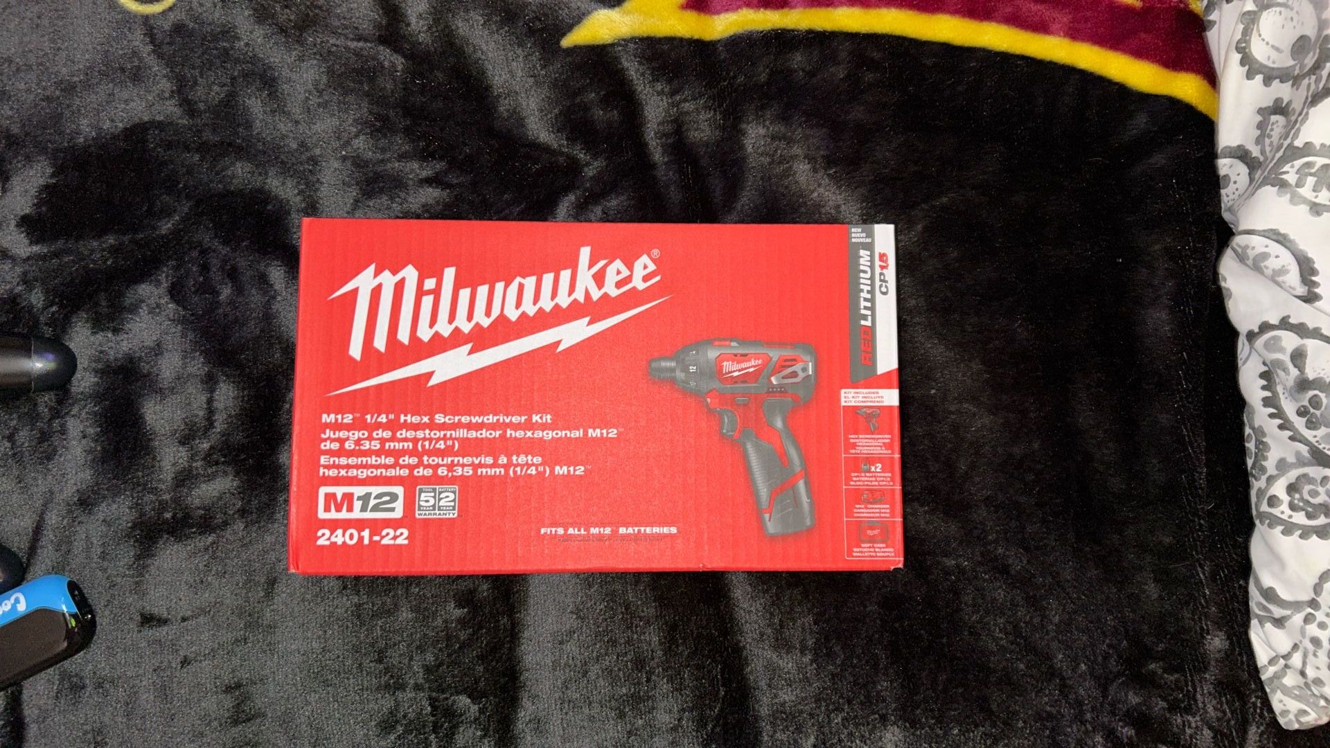 Milwaukee M2 quarter inch hex screwdriver kit with charger and two batteries