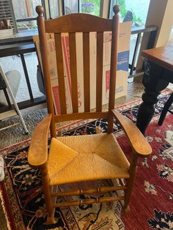 Classic wood rocking chair with woven rush seat