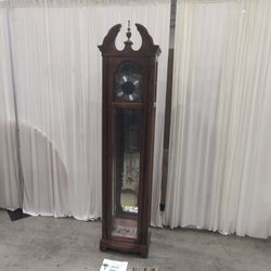 Howard Miller Decorative Wood Grandfather Clock with Brass Pendulum