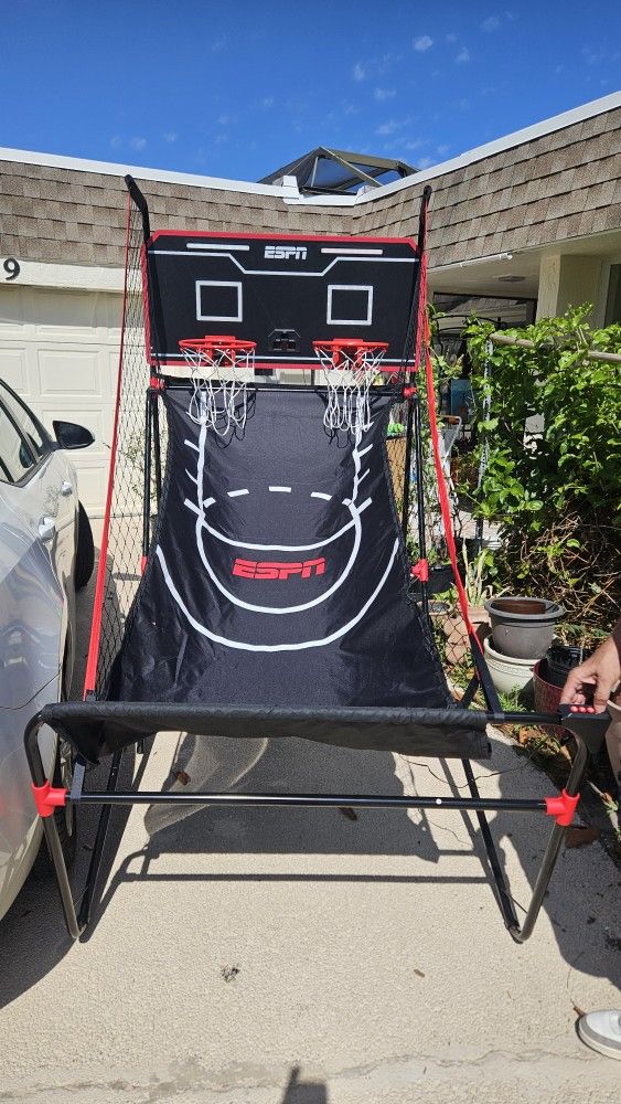 ESPN Pro Competition LED 2-Player Arcade Basketball game.
Features a light-up LED backboard and an electronic scoreboard that tracks points and time