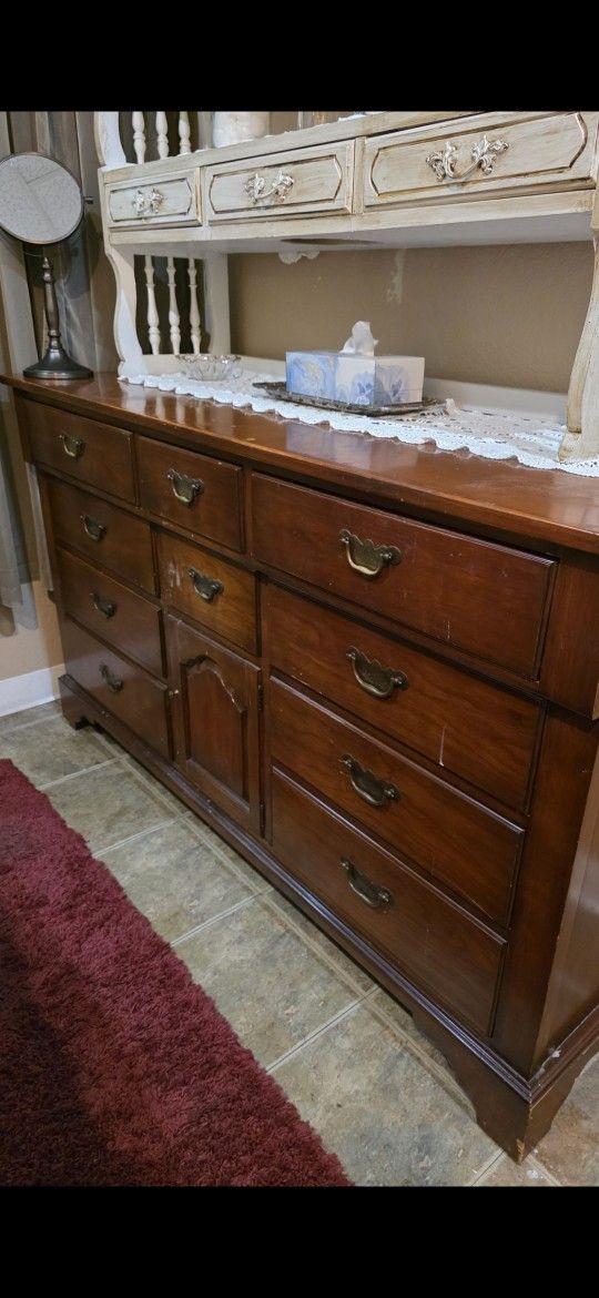 Solid wood dresser with lots of storage – 12 drawers and 1 cabinet in the center.