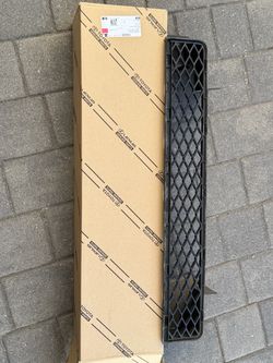 Toyota FJ Cruiser OEM lower front bumper grille in black.