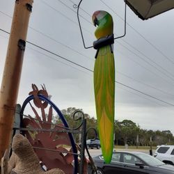 Really Large Colorful Wooden Parrot On A Swing From Indonesia