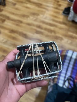 Bike pedals, bike tire, and 3 battle water cages