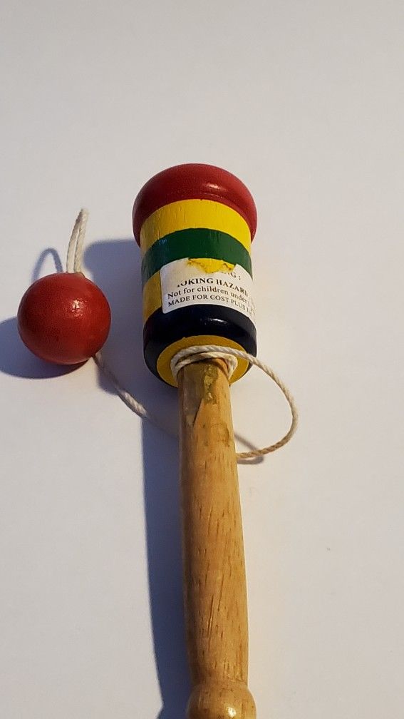 Red. Yellow, Green, Black Wood Game Of Skill With Ball