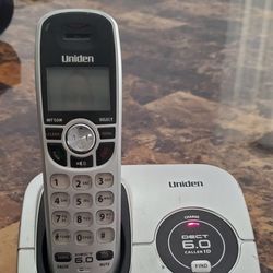 Uniden DECT1560 cordless phone with power cord and phone cord