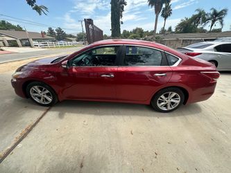 Nissan Altima Red 4-Door Sedan