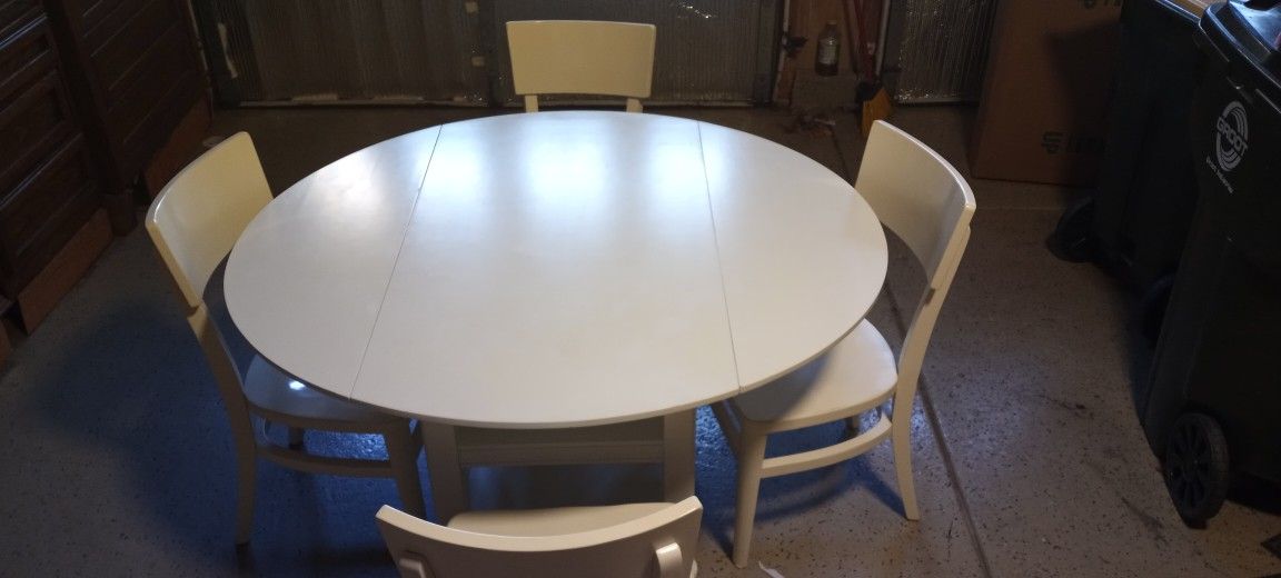 Oval Solid Wood Dining Table And Four Chairs