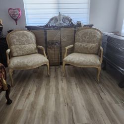 two chairs, white wash, feather cushion. 