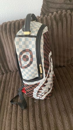 Brown/black checkered spray ground with tag