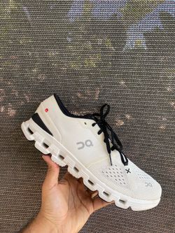 On Cloud X 4 in Ivory/Black. CloudT sole, Swiss flag