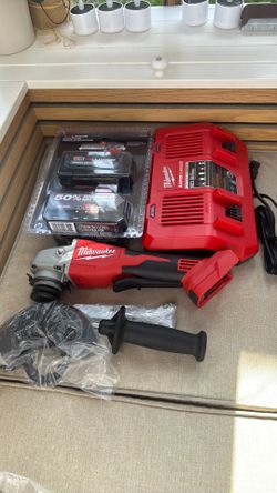 Milwaukee Tools with batteries and chargers