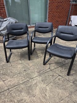 3 faux leather chairs
