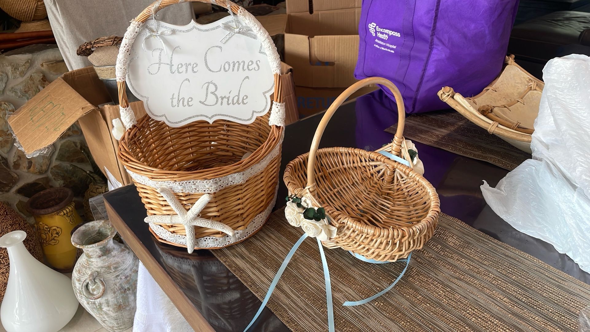 Here comes the bride, and the other side is just married beautiful basket with starfish, smaller flower girl basket with paper roses
