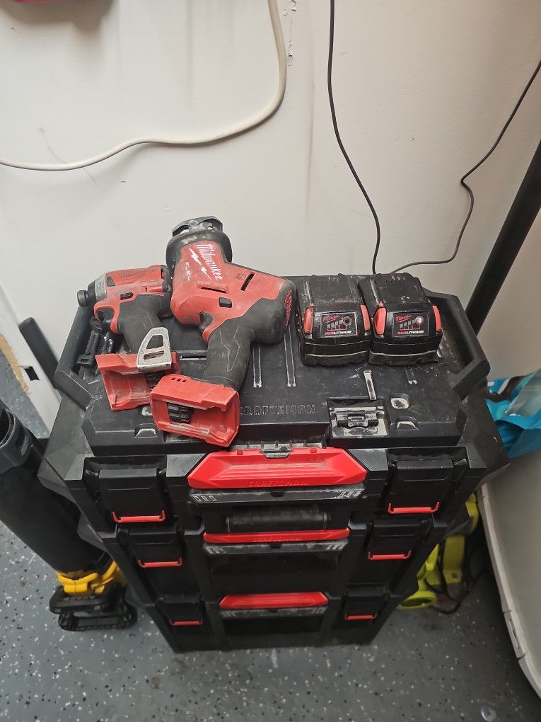 Impact Drill, Hacksaw, and two batteries