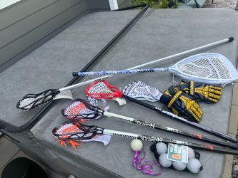 Lot of 5 lacrosse sticks, gloves and balls
