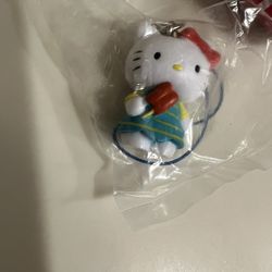 Hello kitty in a summer dress eating a popsicle. Phone/Bag/ Key charm 💞 