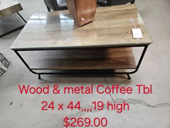 Wood and Metal Coffee Table with Glass Top We are located at 2811 East Bell road. Another Time Around Furniture.