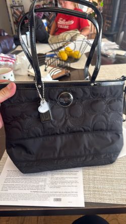 Brand new coach bag sat in closest never used still has tags on it