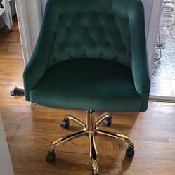 Green velvet chair with gold wheels