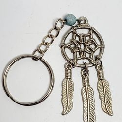 4" Dream Catcher Key Chain Feather Charm Bag Silver-toned Southwestern Jewelry.
The image shows a keychain featuring a dream catcher design. The dream