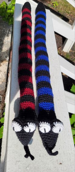 Hand crocheted snake approximately 26" long.  $8 each