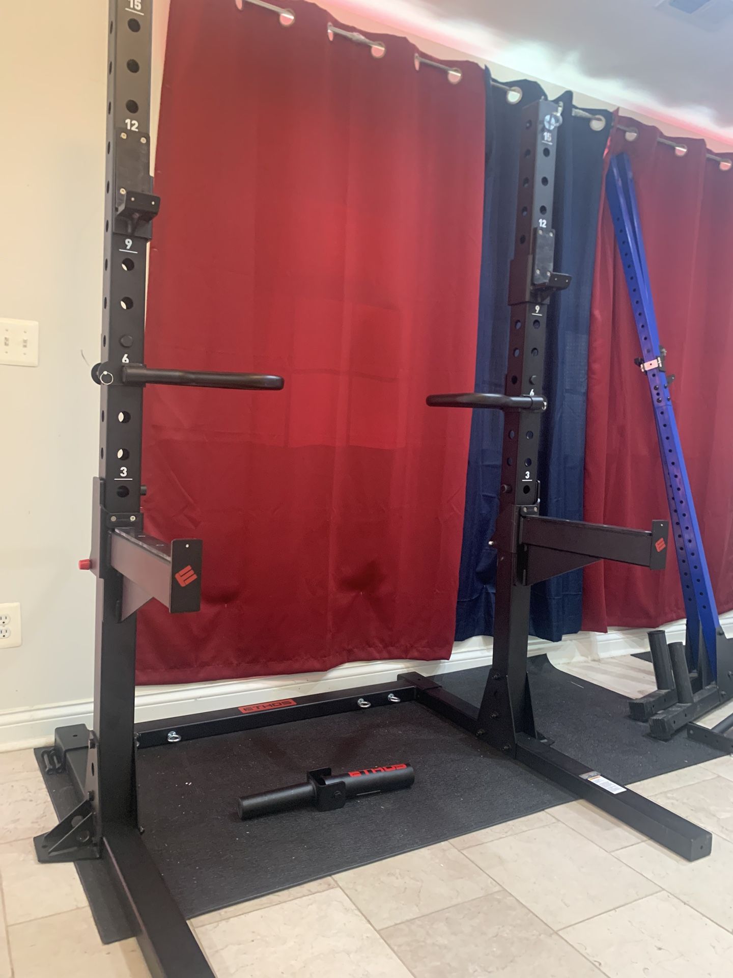 Like new ETHOS Apex Squat Rack with hooks and spotter arms and dip bars and landmine