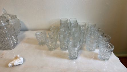 pressed glass tumbler set with lidded jars